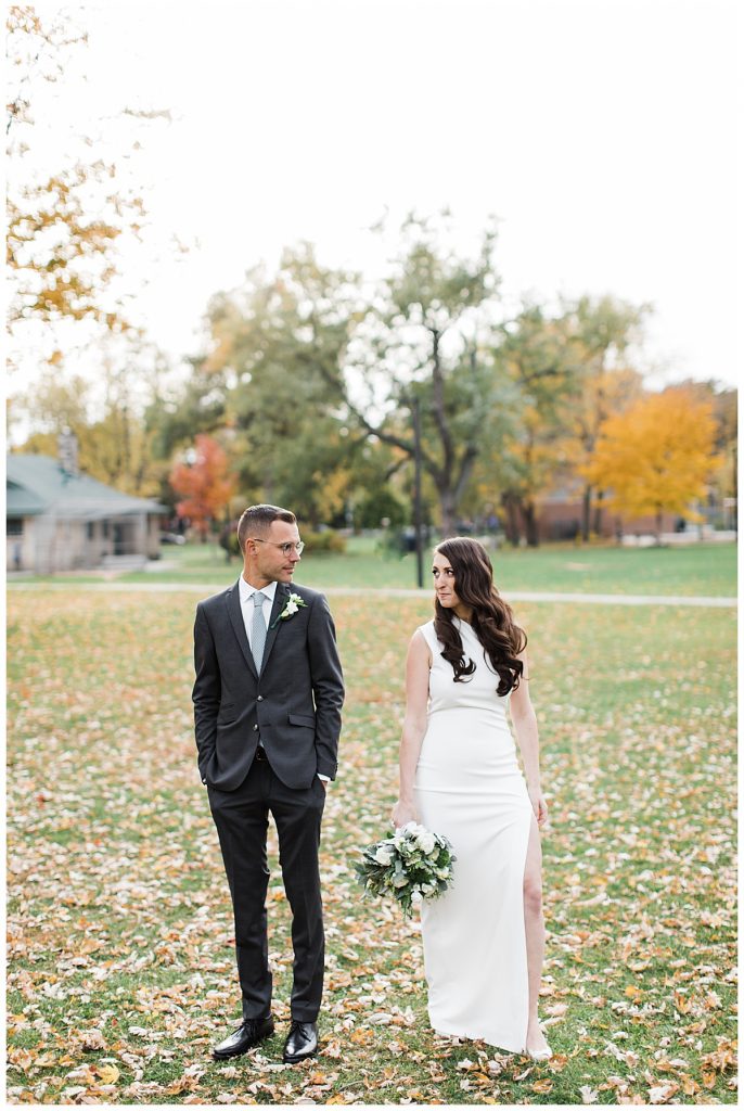 Bride and groom look at each other in fall park wedding portrait| Toronto wedding photographer| Toronto engagement photographer| 3photography 
