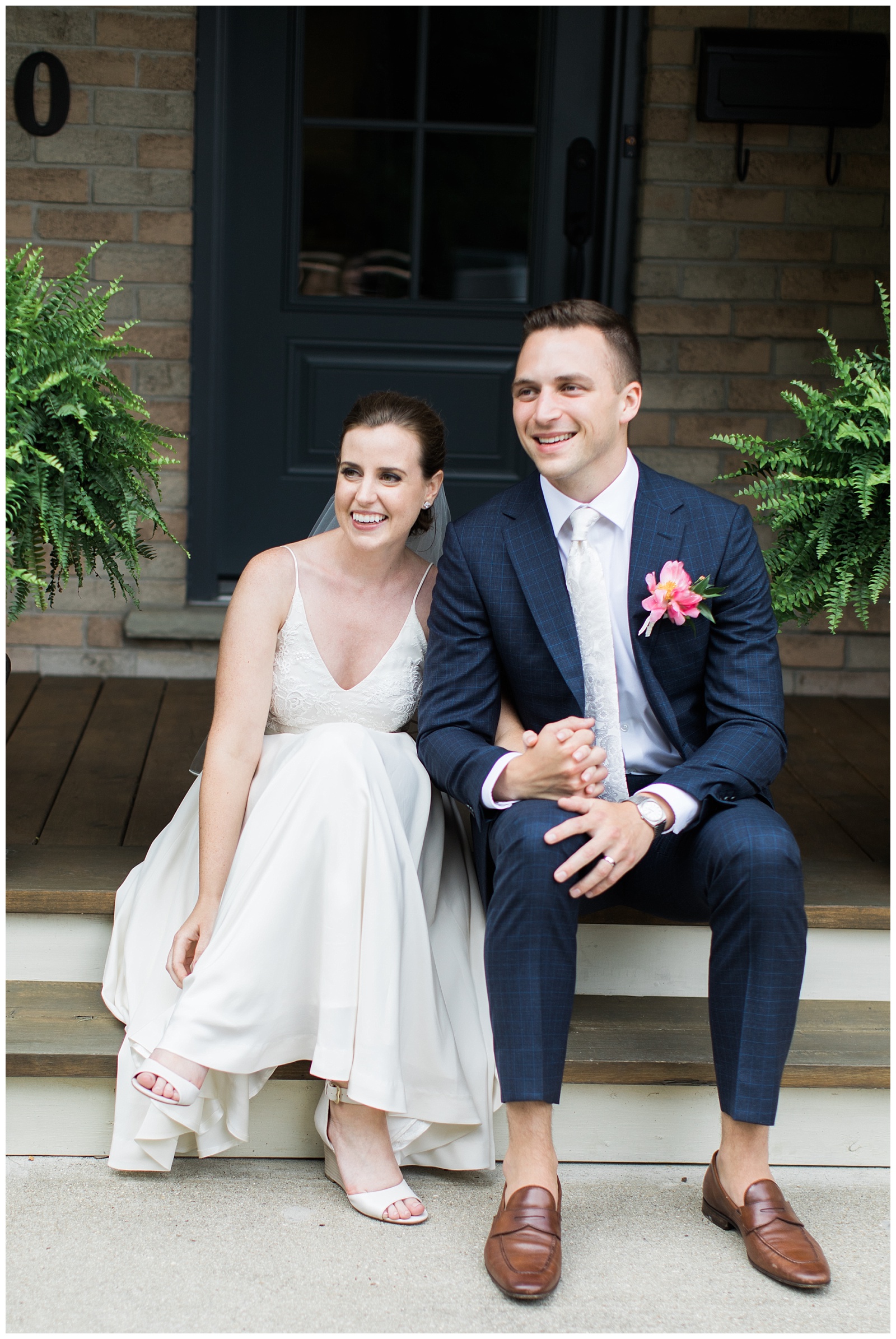 Bride and Groom holding hands and sitting on porch at Guelph Ontario Wedding | Ontario Wedding Photographer | Toronto Wedding Photographer | 3photography