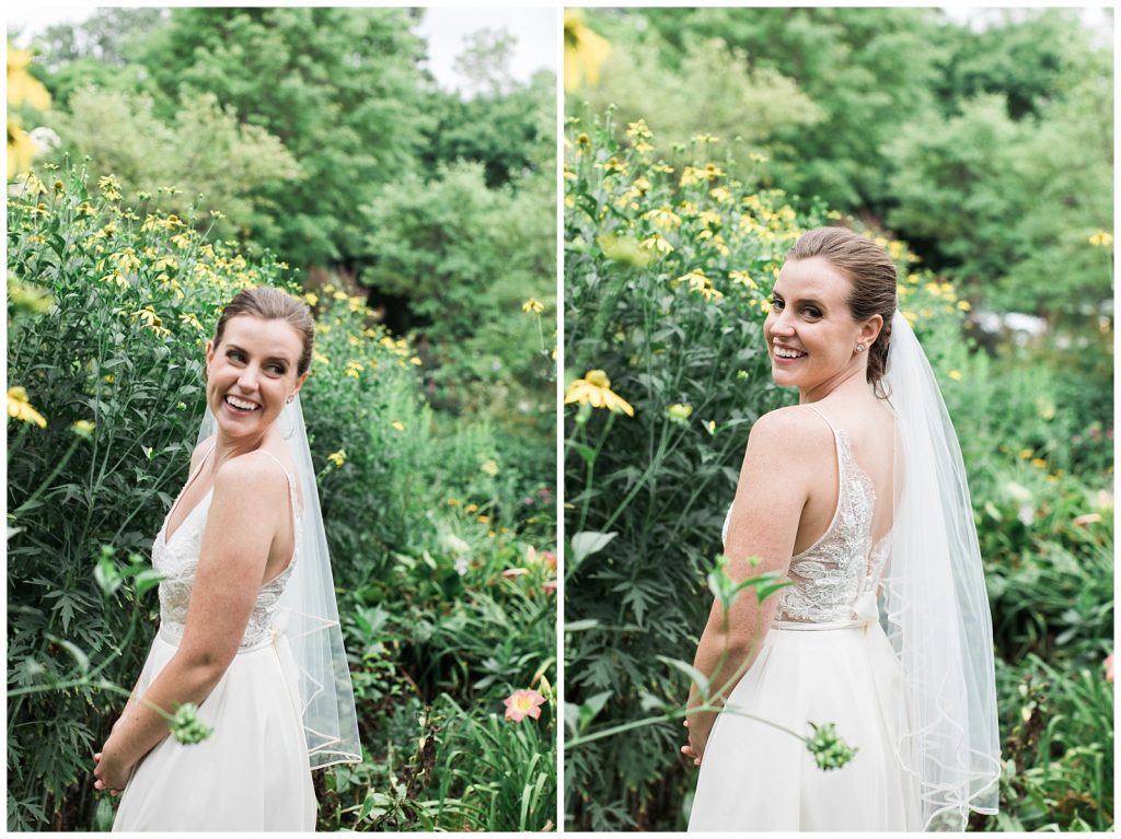 Gorgeous smiling bride looking back over her shoulder in gardens at Guelph Ontario Wedding | Ontario Wedding Photographer | Toronto Wedding Photographer | 3photography