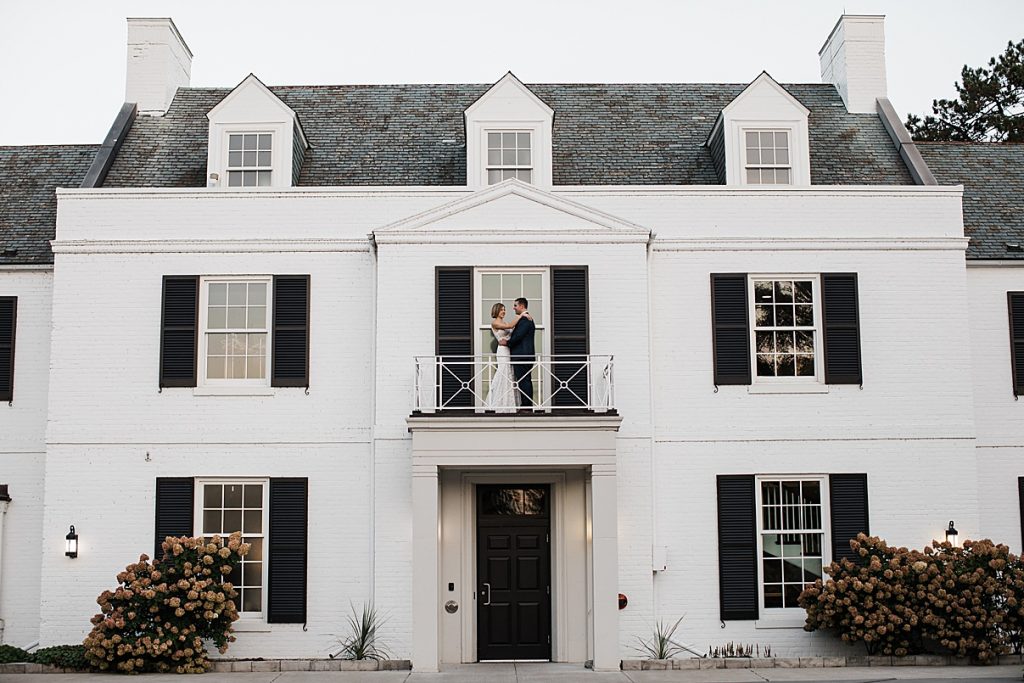 Bride and groom on balcony of mansion| Harding Waterfront Estate Wedding| Ontario wedding photographer| Toronto wedding photographer| 3 Photography | 3photography.ca