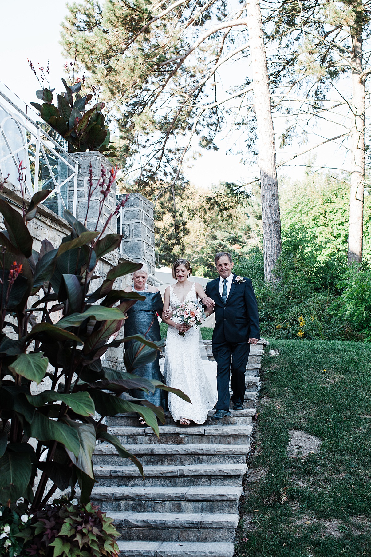 Bride walking down steps with parents| Harding Waterfront Estate Wedding| Ontario wedding photographer| Toronto wedding photographer| 3 Photography | 3photography.ca