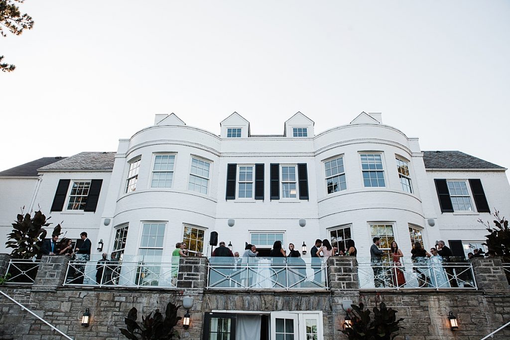 Guests on balcony of mansion| Harding Waterfront Estate Wedding| Ontario wedding photographer| Toronto wedding photographer| 3 Photography | 3photography.ca