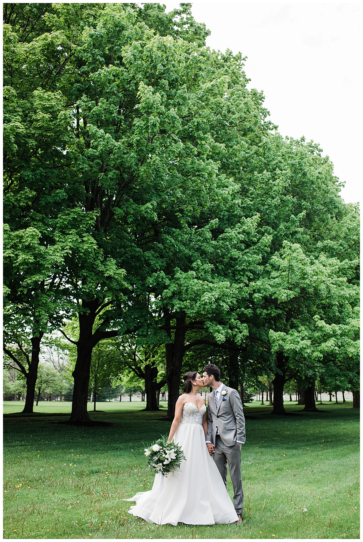 Bride and groom kiss walking across tree-farm| Belcroft Estate Wedding| Toronto wedding photographer| Ontario wedding photographer| 3photography