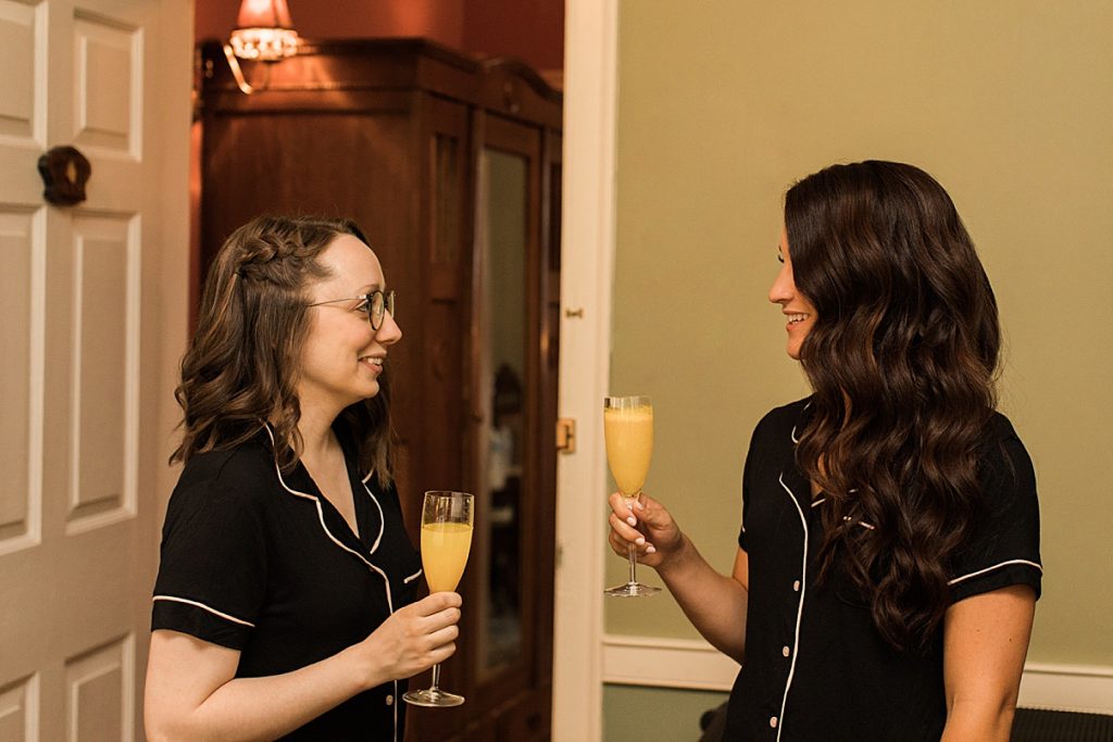 Bride and bridesmaid having a drink while getting ready| Hollie and Brian| Balls Falls, Ontario Wedding| Ontario Wedding Photographer| Toronto Wedding Photographer| 3Photography|3photography.ca