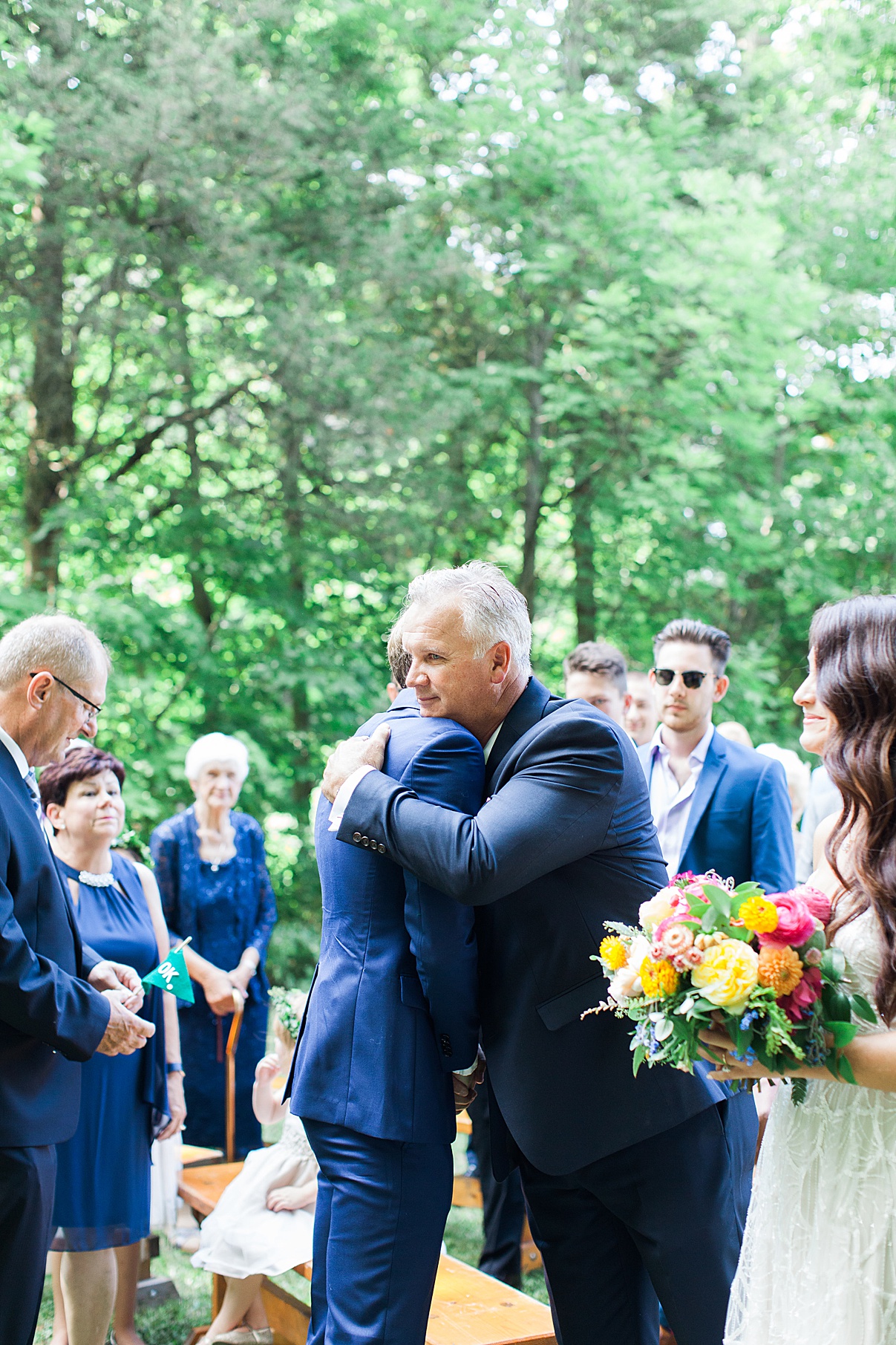 Groom hugs father of the bride at Balls Falls Wedding|Hollie and Brian| Balls Falls, Ontario Wedding| Ontario Wedding Photographer| Toronto Wedding Photographer| 3Photography| 3photography.ca