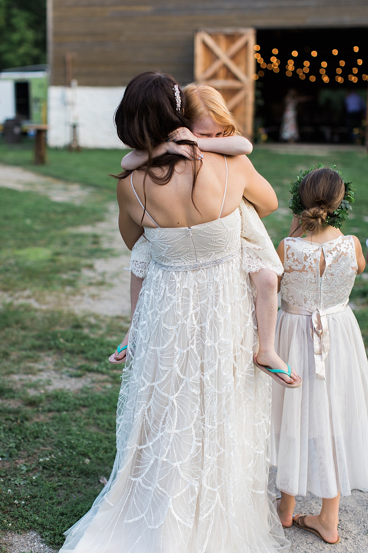 Bride walking while holding flower girl | Balls Falls, Ontario Wedding| Ontario Wedding Photographer| Toronto Wedding Photographer| 3Photography| 3photography.ca