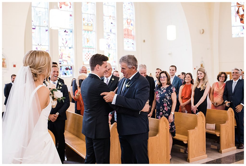 Groom and bride's father embrace each other at alter| Ontario wedding| Toronto wedding photographer| 3photography 