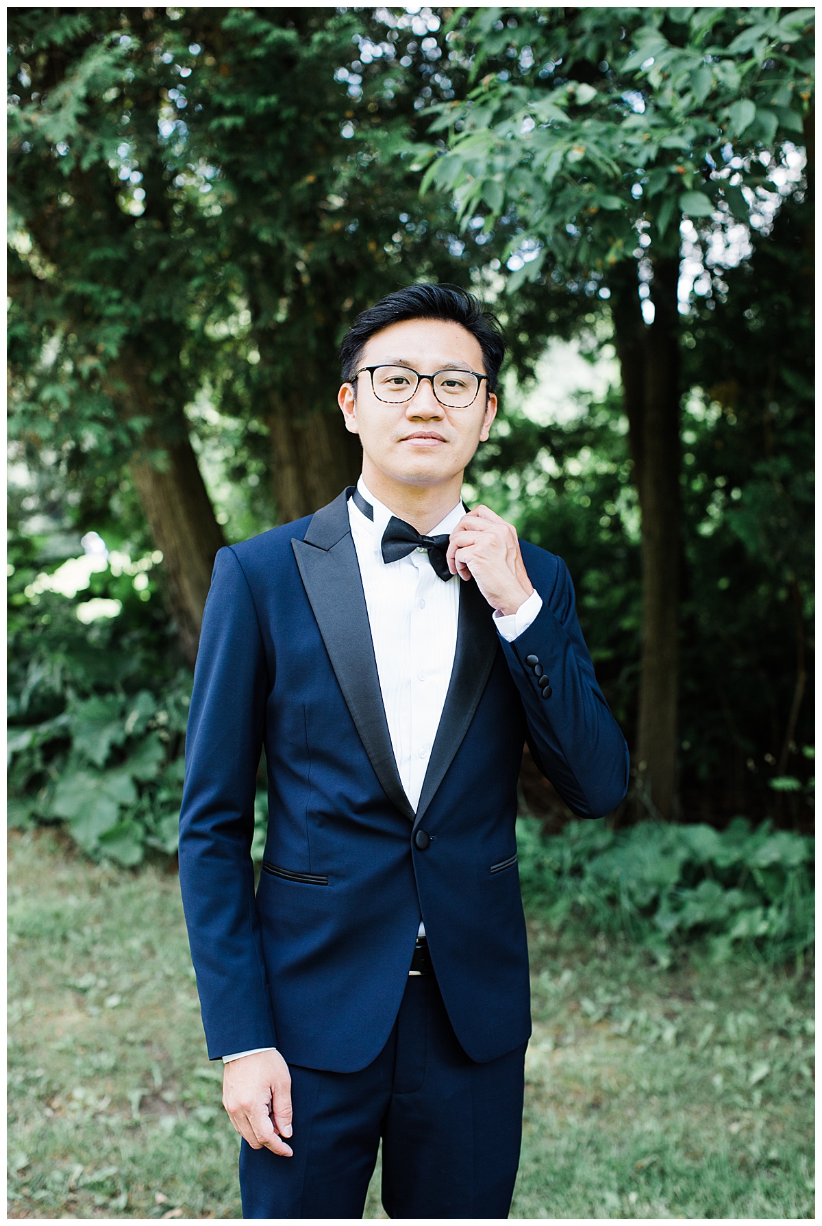 Asian groom stands in blue tux awaiting his bride for first look| Adamo Estate Winery wedding| 3photography