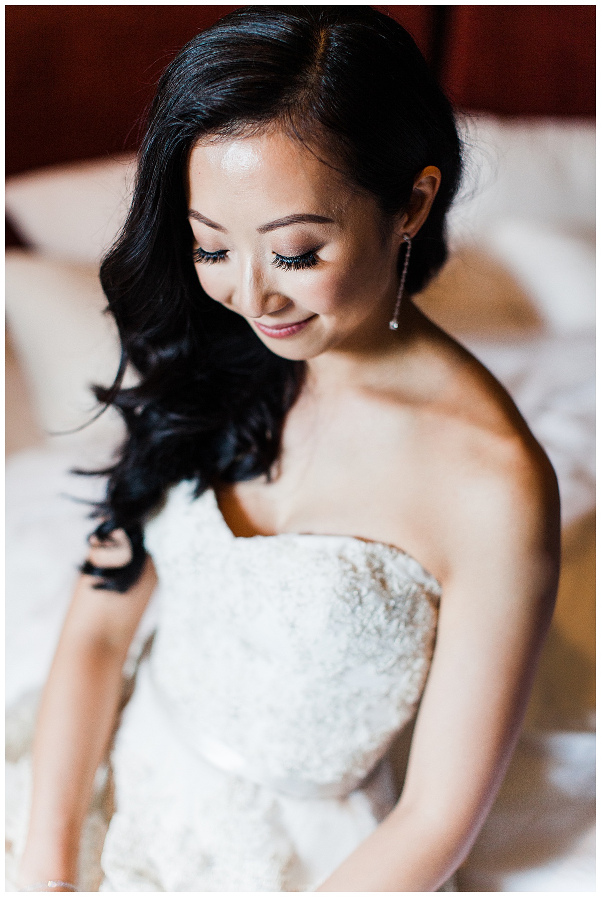 Bride looking down showing off bridal makeup and tear drop earring| winery wedding| Asian bride| Toronto photographer| 3photography