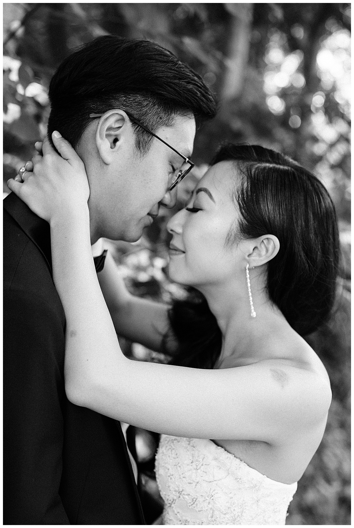 Black and white of bride nuzzling groom with hands gently wrapped around the back of his neck| bride and groom portrait| winery wedding| 3photography