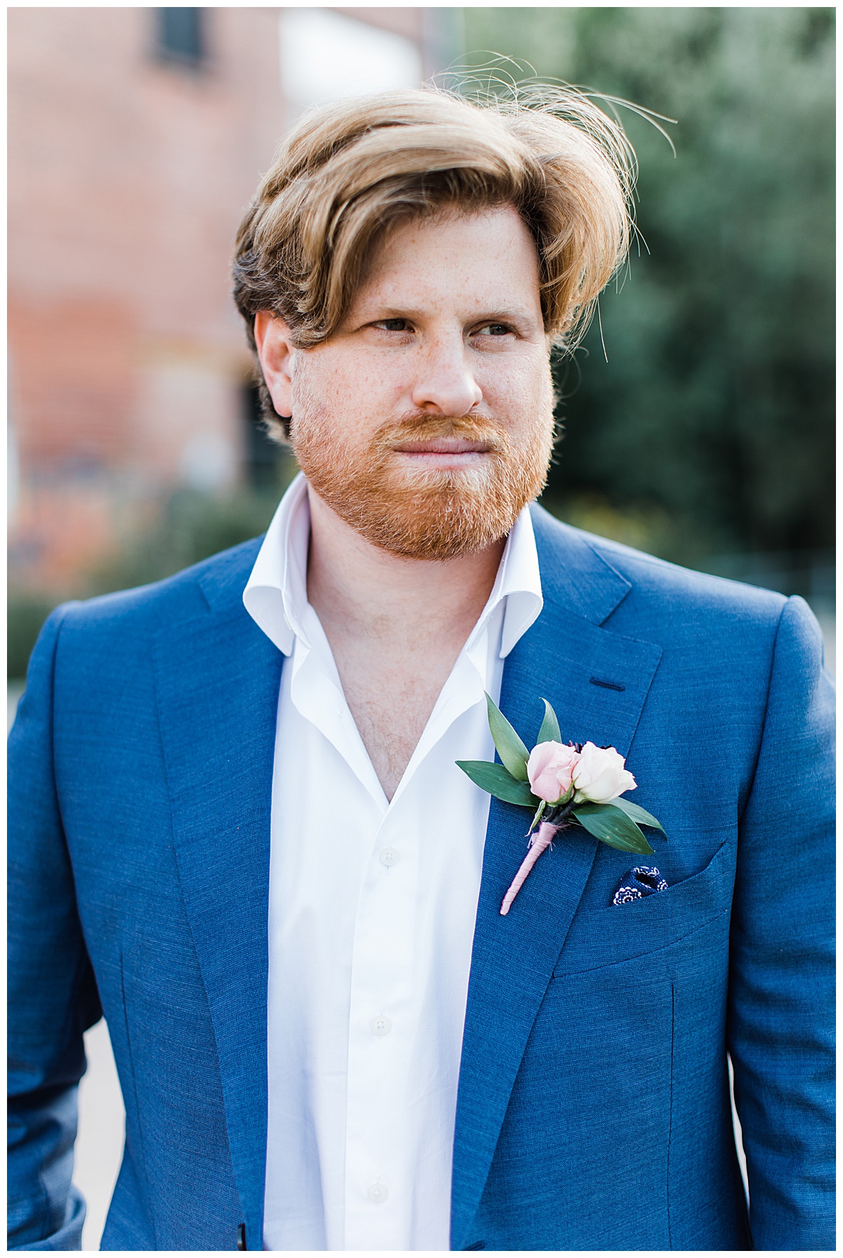 Close up groom portrait in blue and white