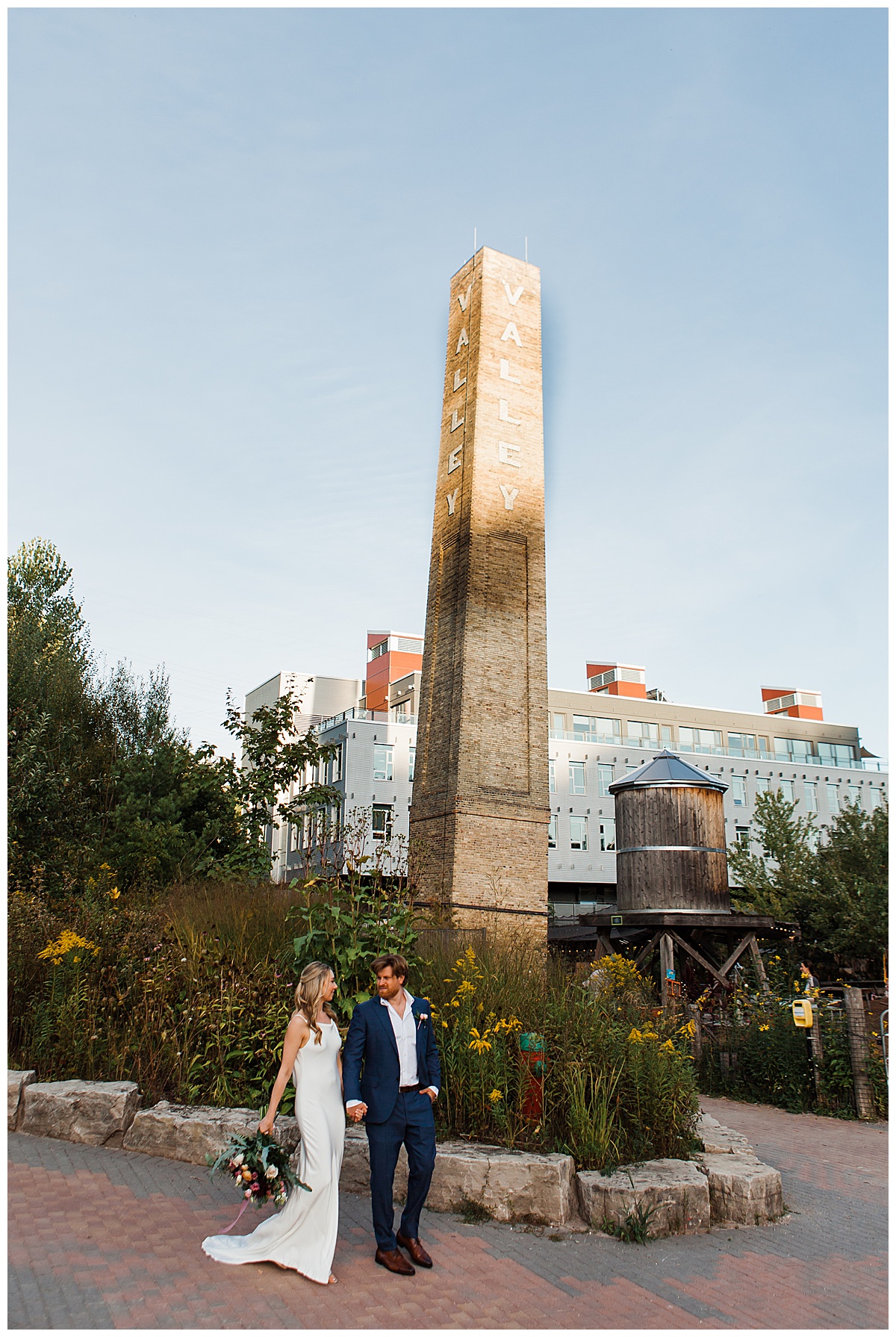 Bride and groom walking outside the jam factory Canada