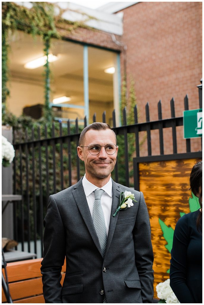 Groom smiles while awaiting bride to walk down aisle| Maple Leaf Tavern wedding| Toronto wedding photographer| Toronto engagement photographer| 3photography