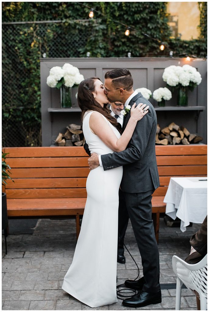 Bride and groom kiss at alter| Toronto wedding photographer| 3photography